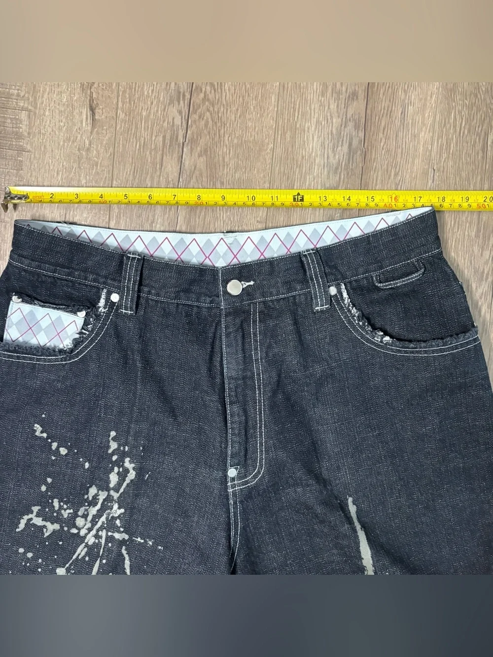 These wide-leg black jeans with white paint splatters Size 36x28